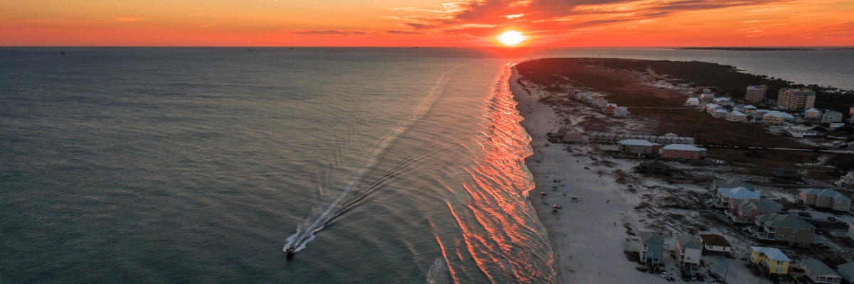 Gulf Shore Coast with a boat running along it.